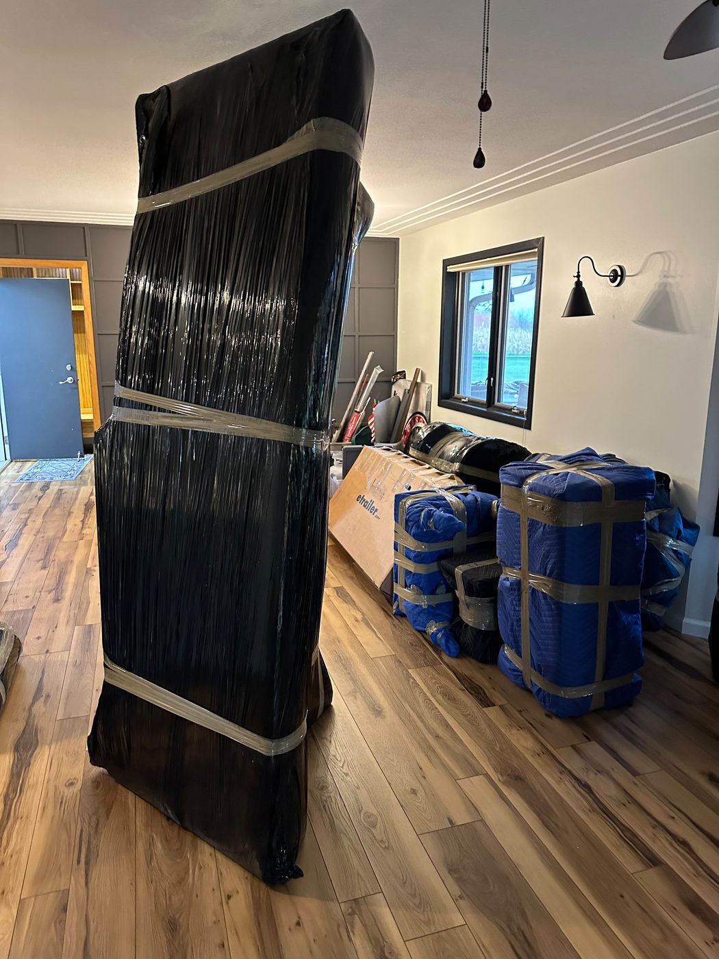 Living-room furniture wrapped for a cross-country haul — Chicago to Salt Lake City long-distance moving